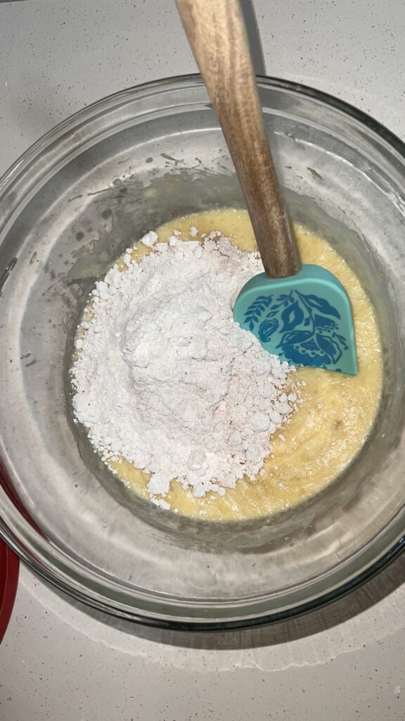 Add flour to the wet ingredients