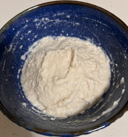 Baby oatmeal bowl with yogurt and fresh apple sauce