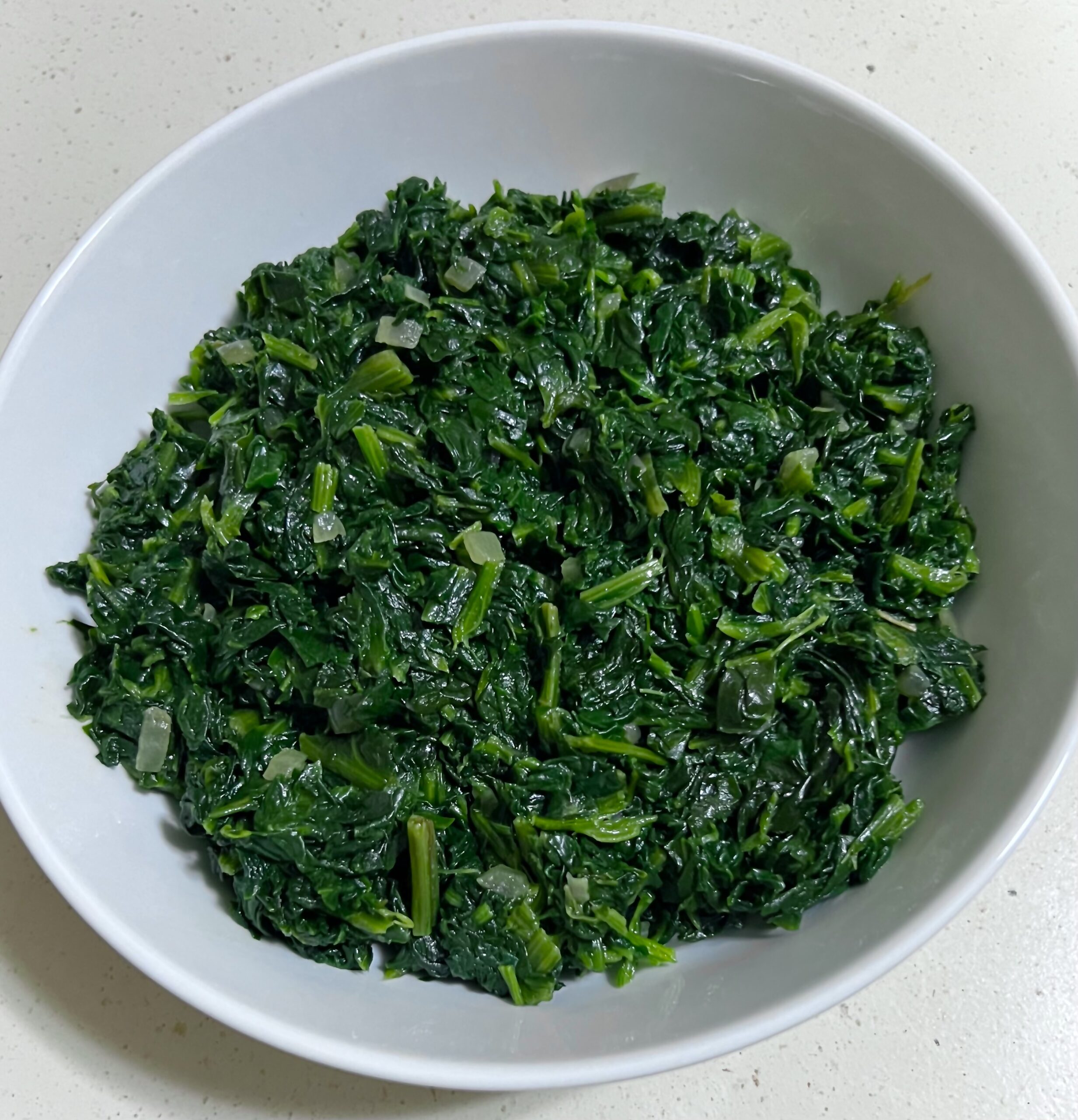 Cooked frozen spinach in a bowl