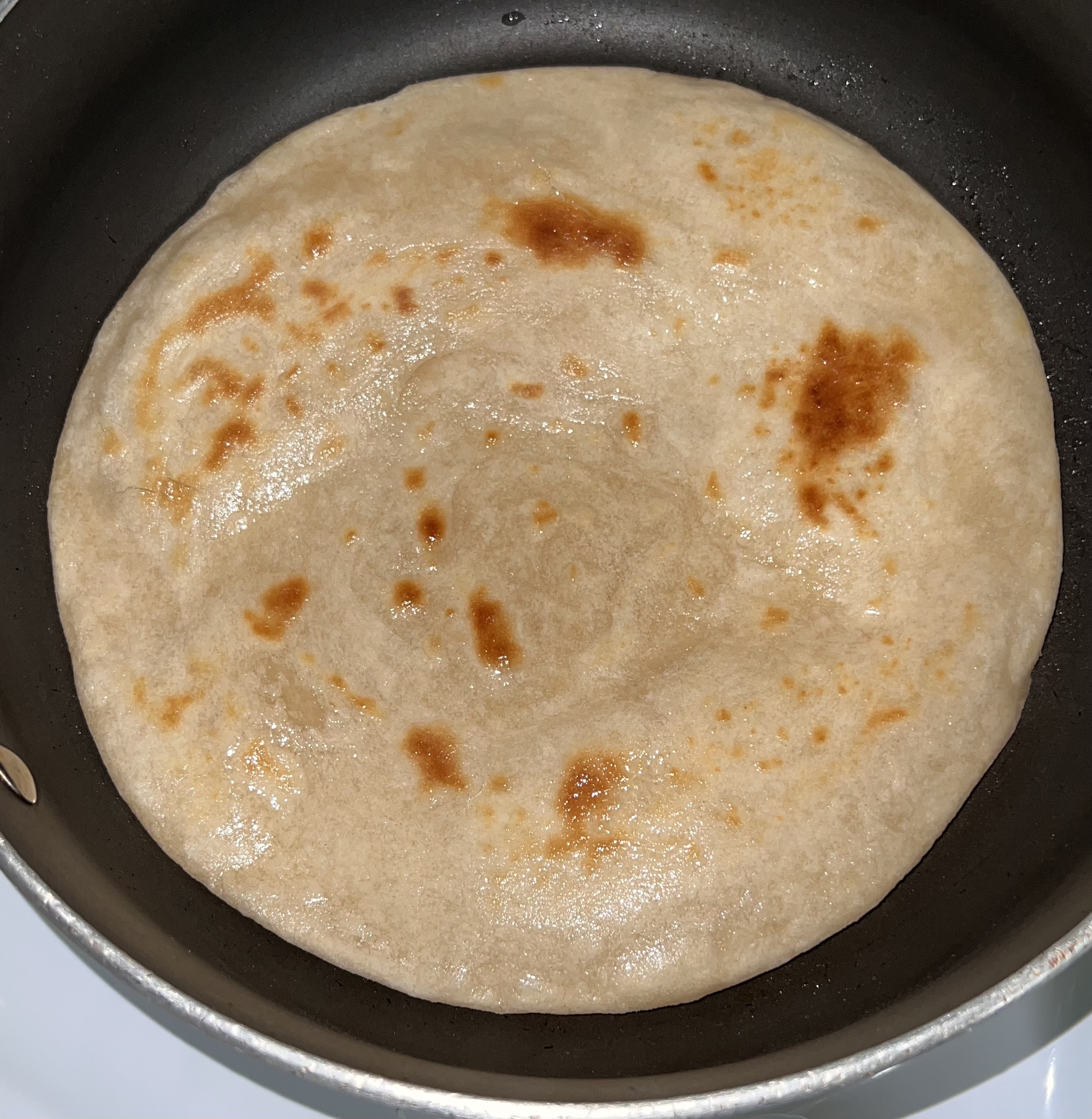 Cooking chapati step 4