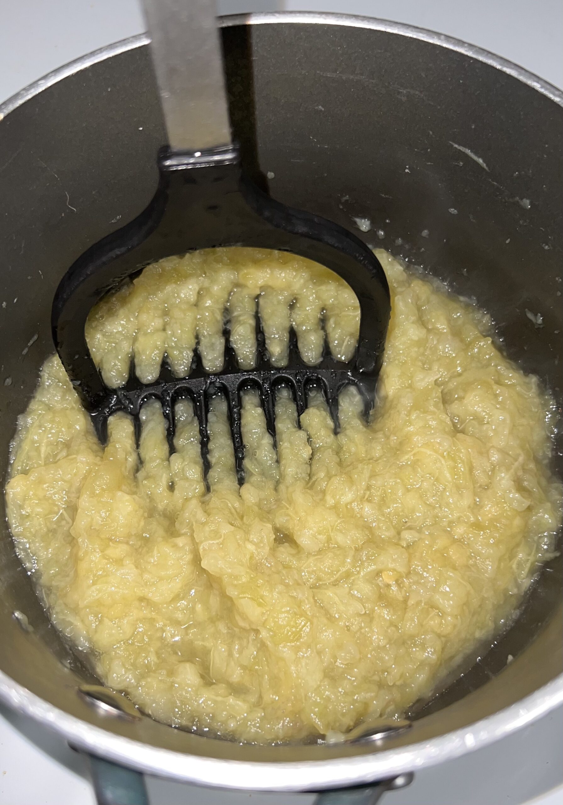 Mashing the cooked eggplant