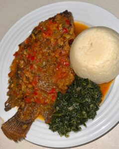 Tilapia, ugali and spinach