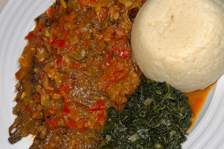 Tilapia, ugali and spinach