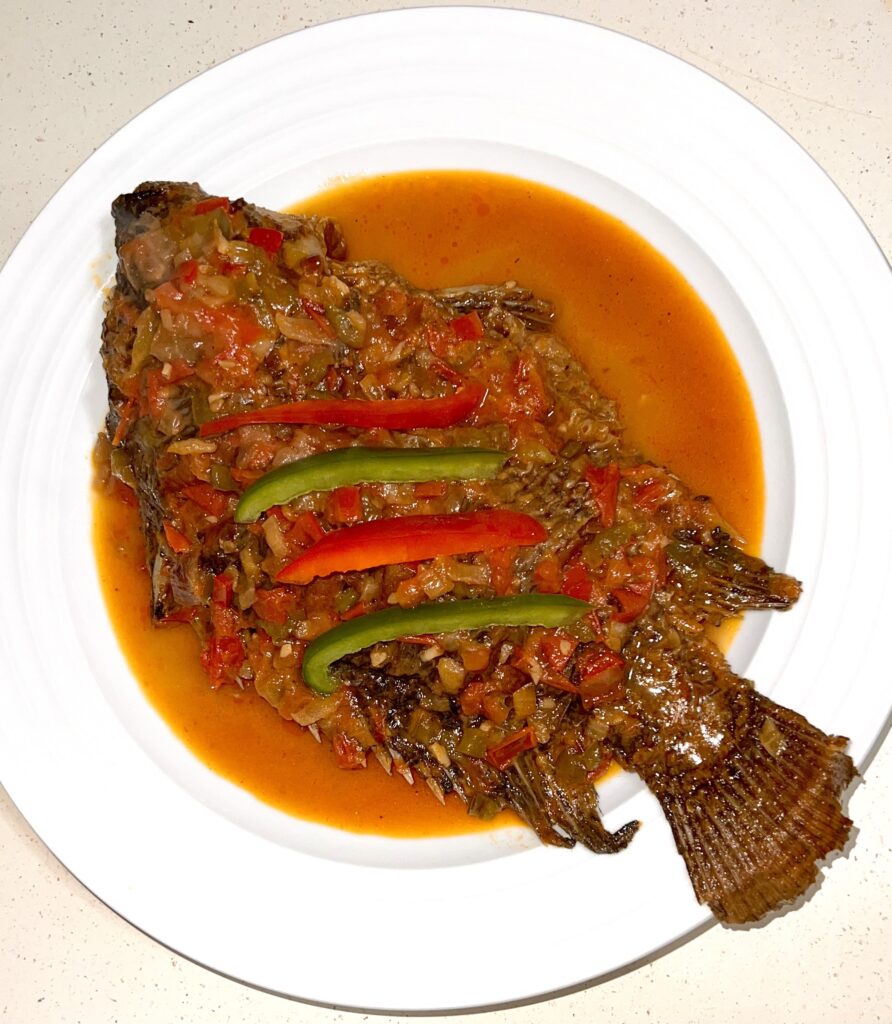 Whole fried tilapia stew