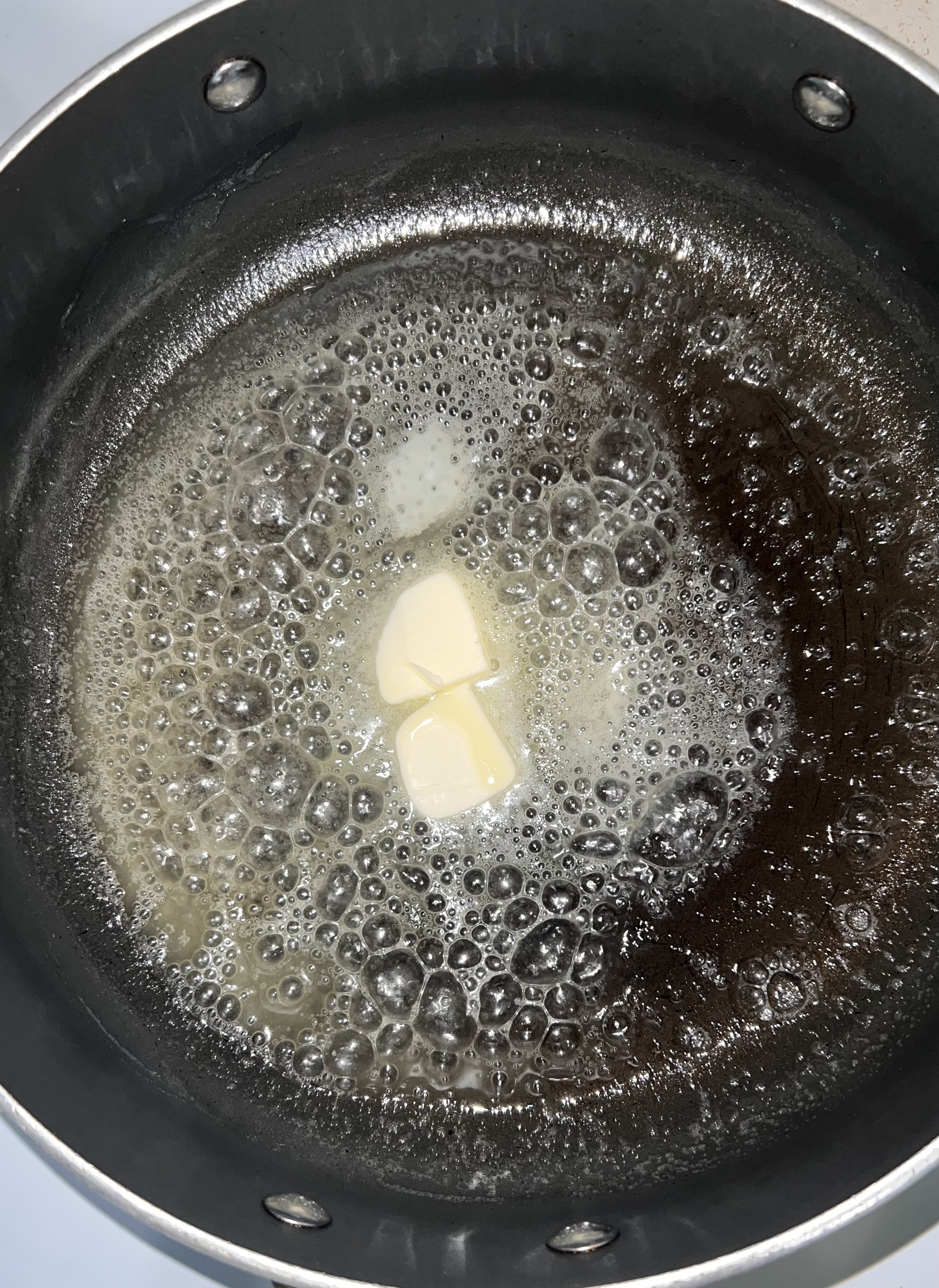 Butter melting on a pan