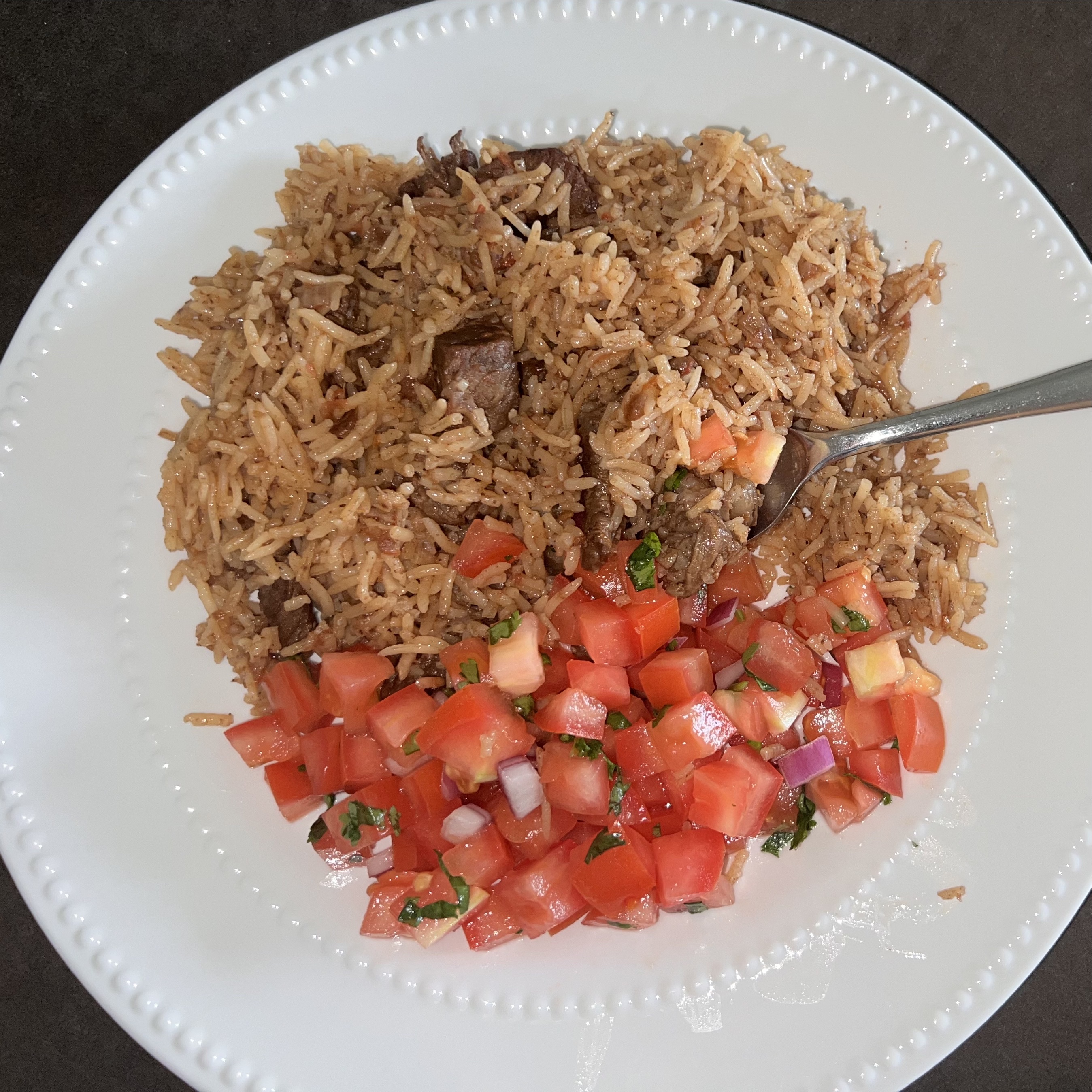 Pilau and Kachumbari on a plate