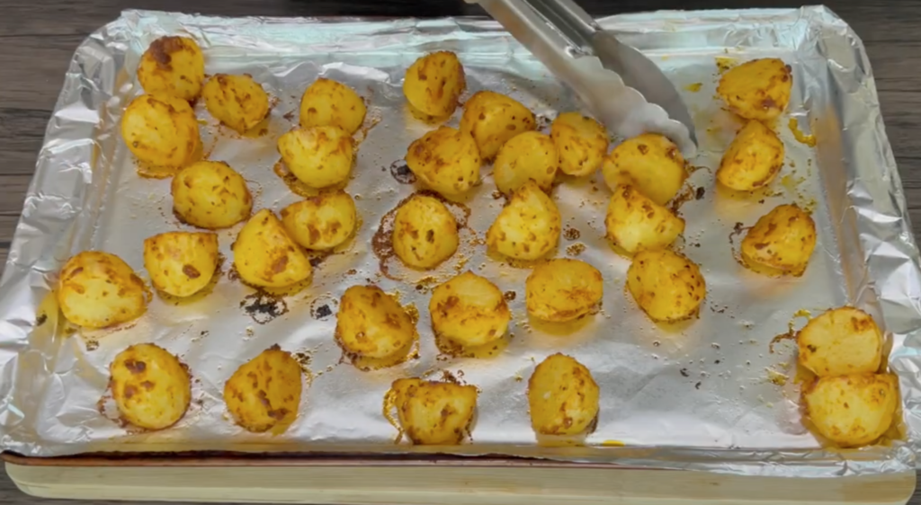 Ready potatoes on a baking sheet