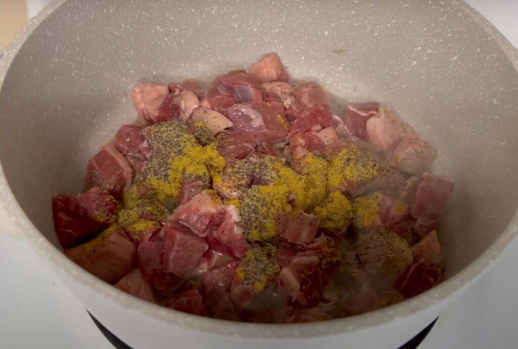 Beef in a pot with seasoning