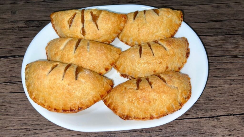 Handmade apple pies on a plate