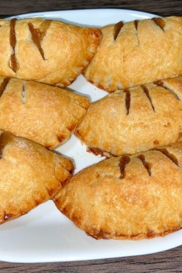 Handmade apple pies on a plate