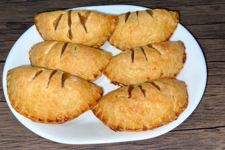 Handmade apple pies on a plate