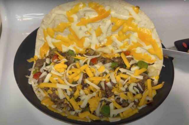 Folding a beef quesadilla