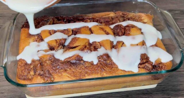 Pouring glaze over apple cinnamon cake